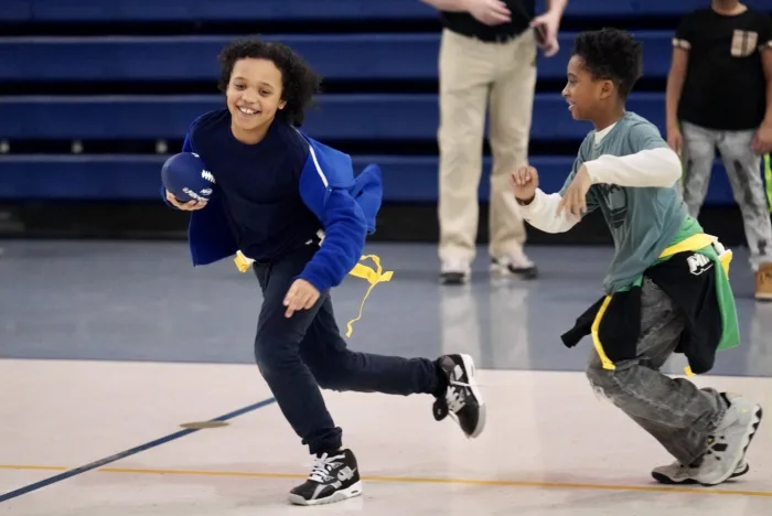 Students playing NFL FLAG football at school